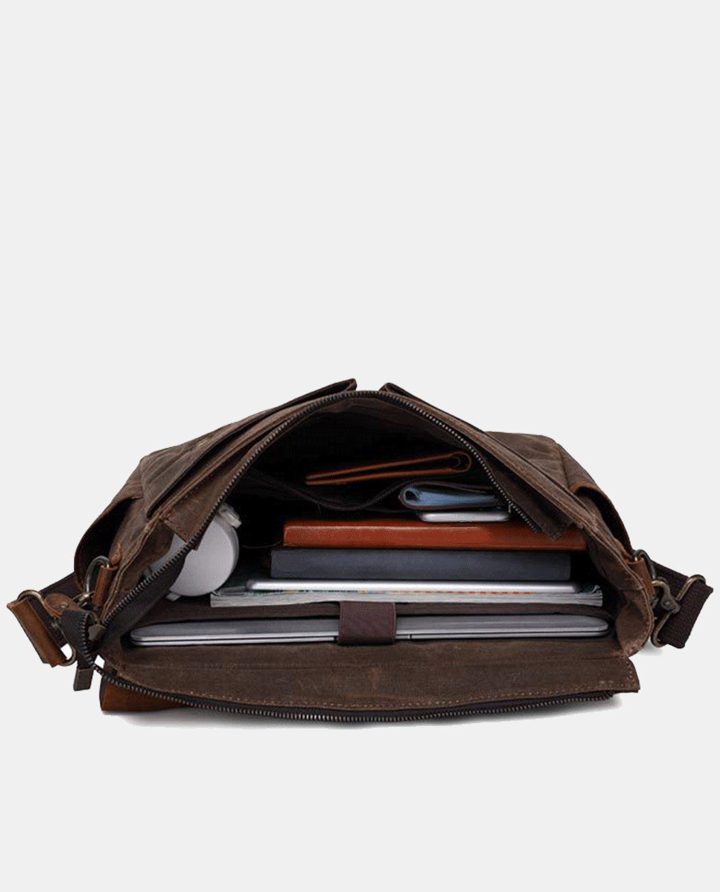 Interior of brown canvas messenger bag with leather flap